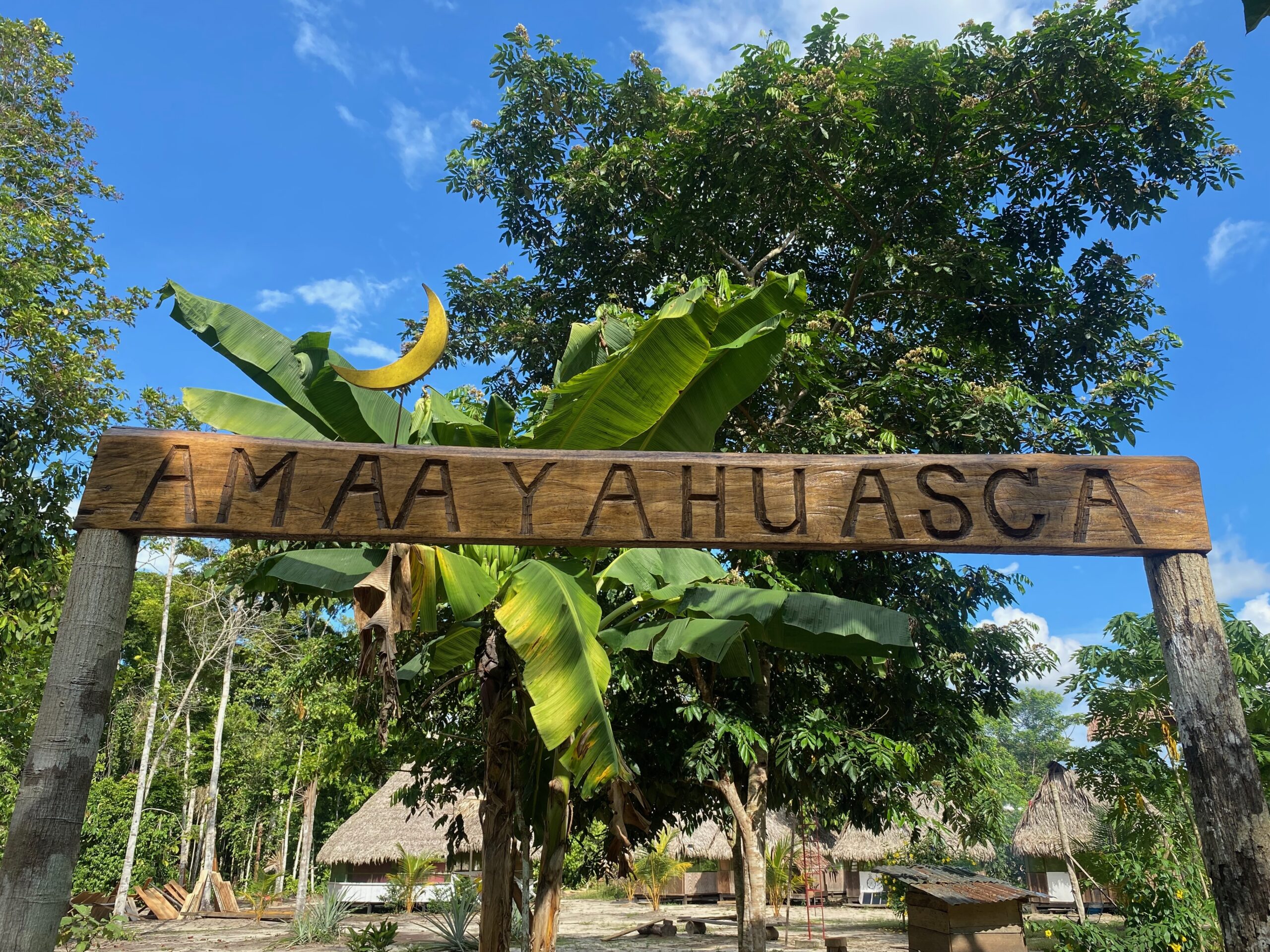 Ayahuasca Retreats in Peru. Entrance to the AMAAYAHUASCA retreat center surrounded by Amazon rainforest in Peru